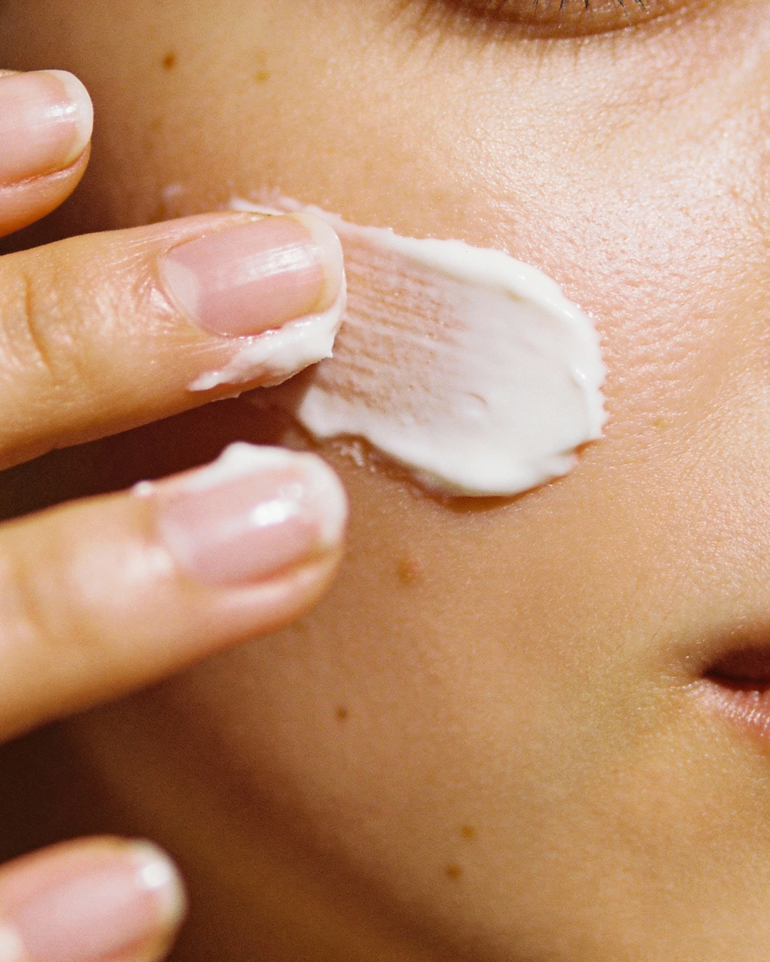 a cream applied to a woman's face